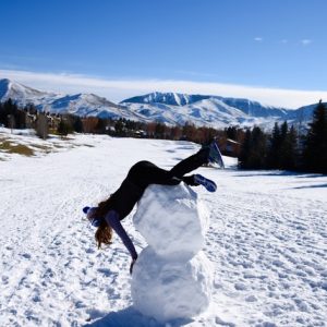 Julia Kern on top of a snowman